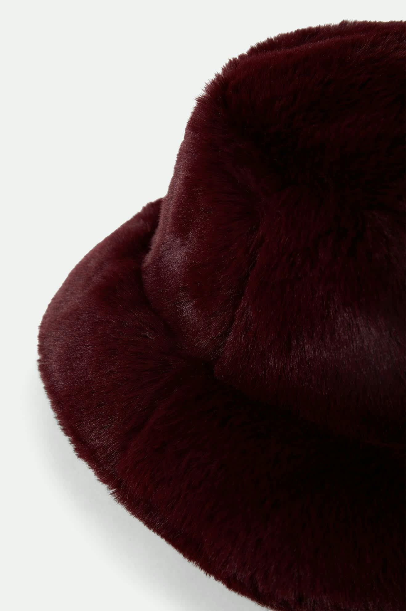 Women's Dion Packable Winter Bucket Hat in the color Port - Additional Laydown image