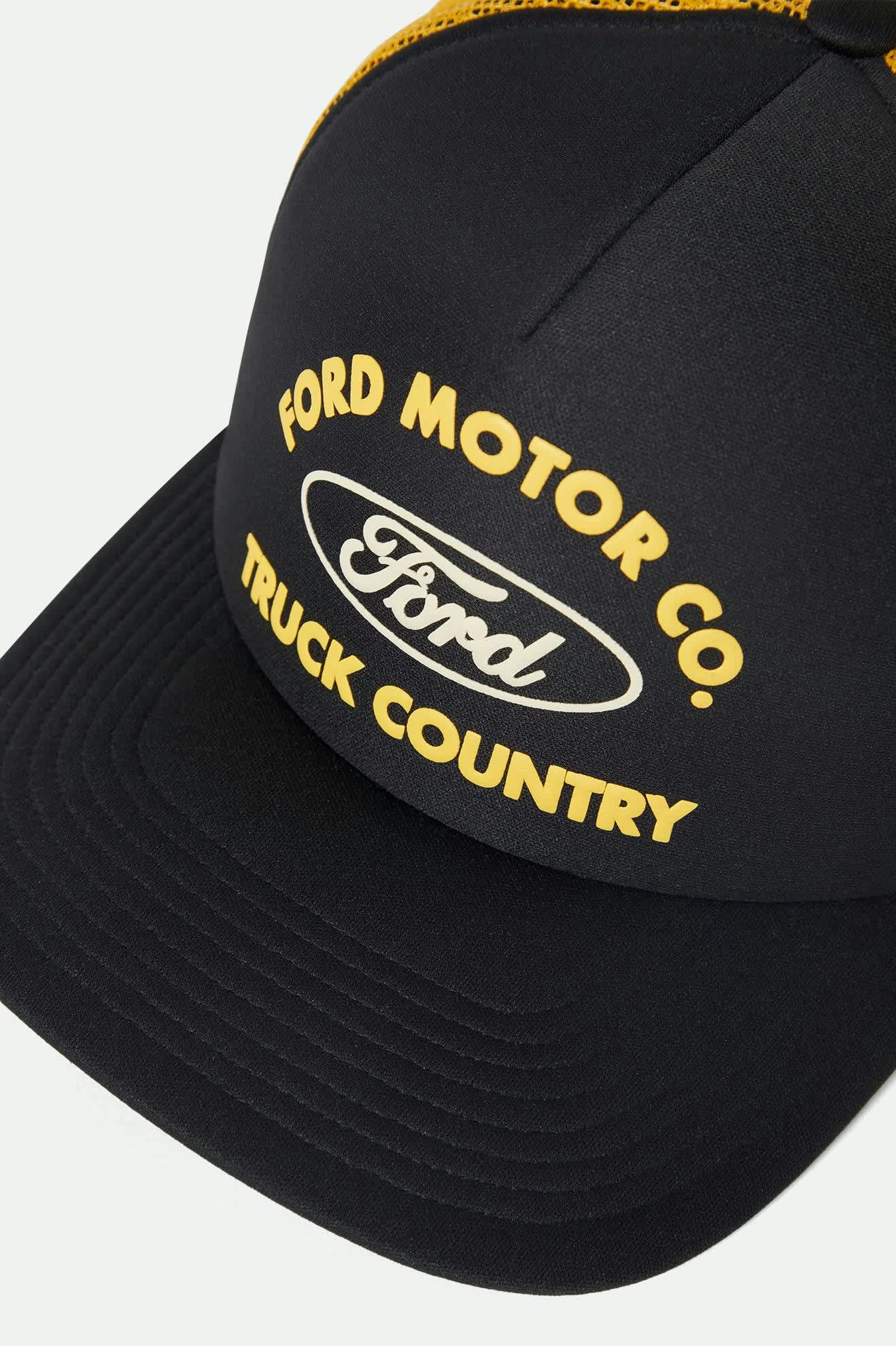 Unisex Ford Built Tough Trucker Hat in the color Burnt Rubber/Empire Yellow - Additional Laydown image