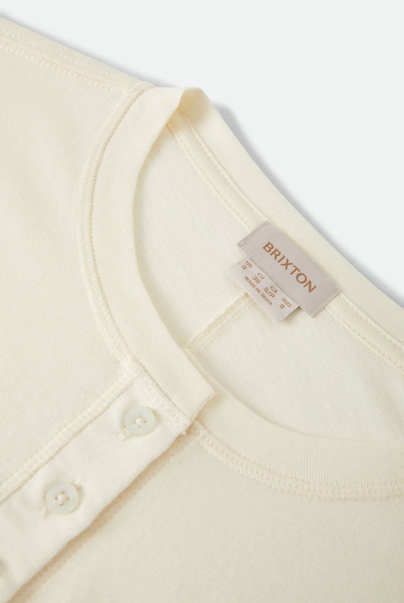Women's Carefree Organic Garment Dye Cropped Henley in the color Off White/Rust - Additional Laydown image
