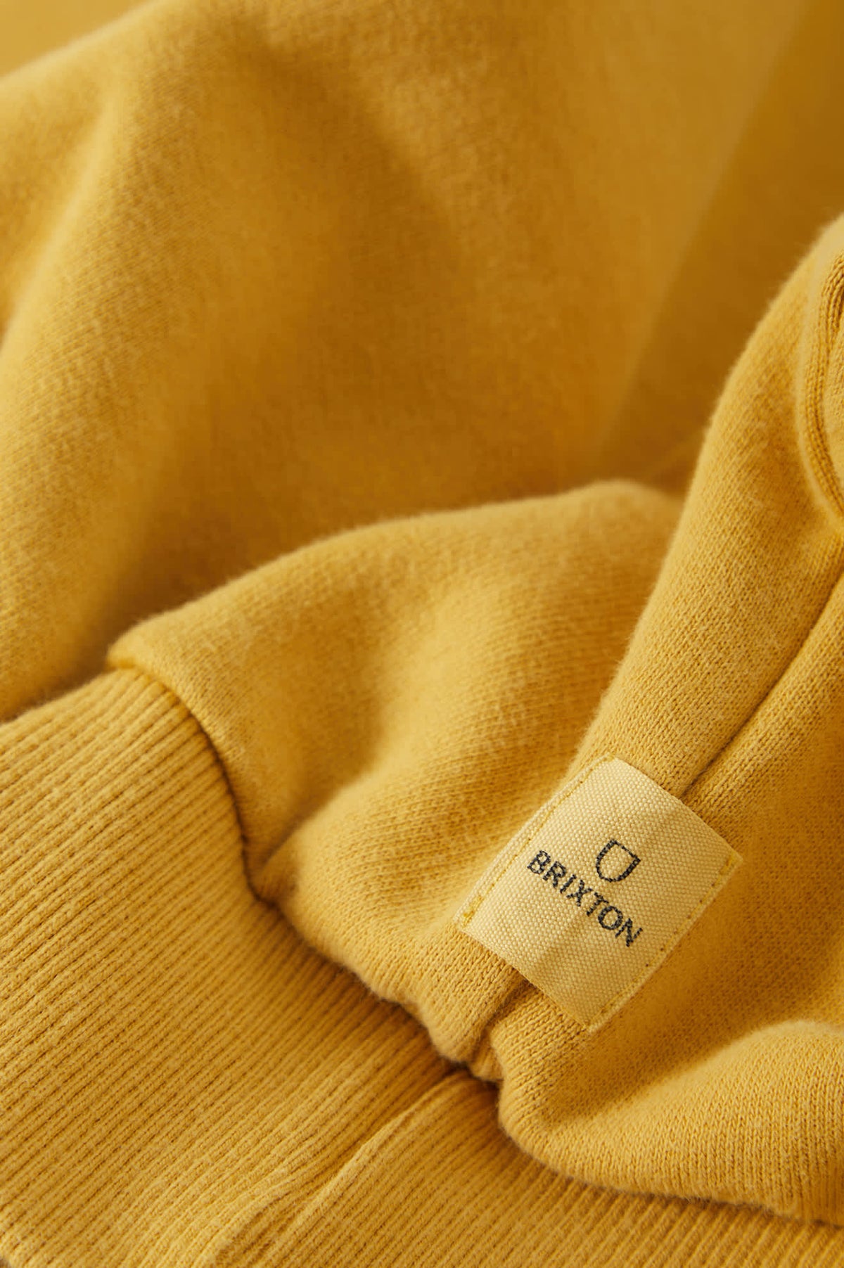 Men's Brixton Baseline Crew Fleece in the color Dusted Ochre Vintage Wash - Additional Laydown image