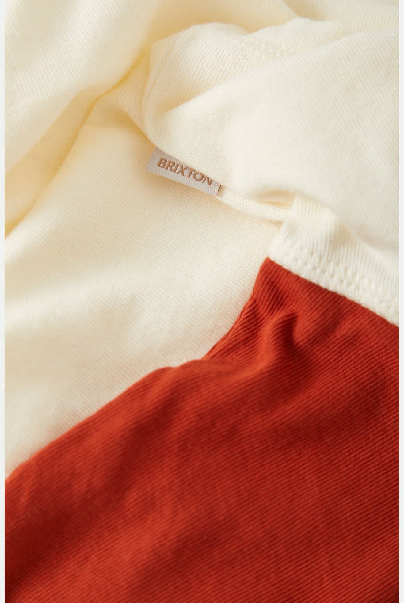 Women's Carefree Organic Garment Dye Cropped Henley in the color Off White/Rust - Additional Laydown image