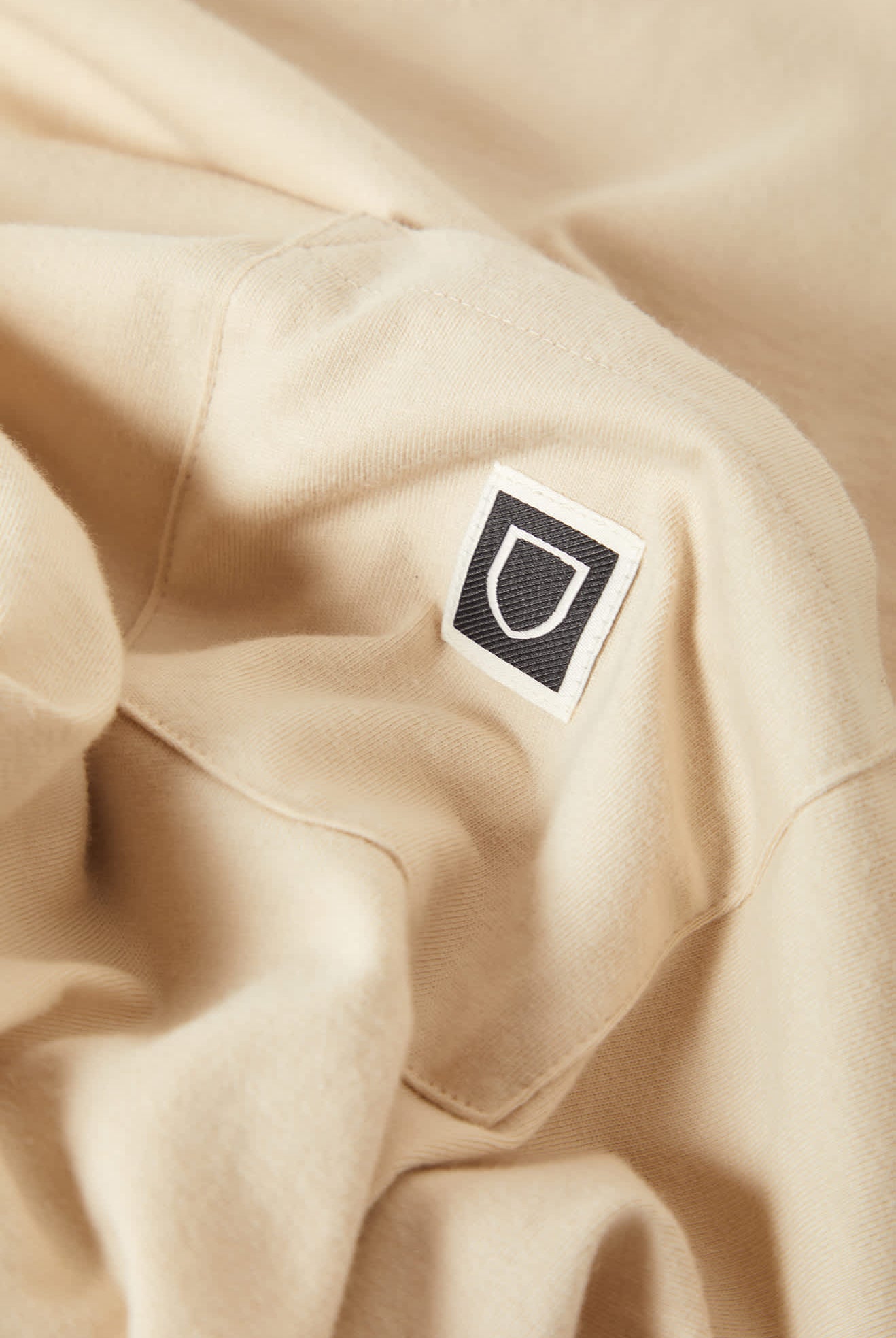 Men's Beta Sheild Short Sleeve Pocket T-Shirt in the color Cream - Additional Laydown image