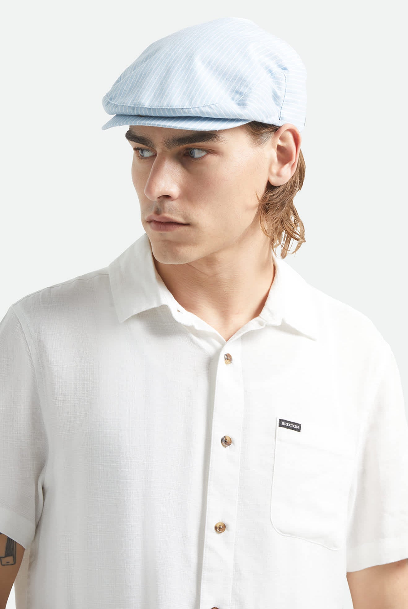 Unisex Hooligan Flat Cap in the color Light Blue/White - Men's Front View