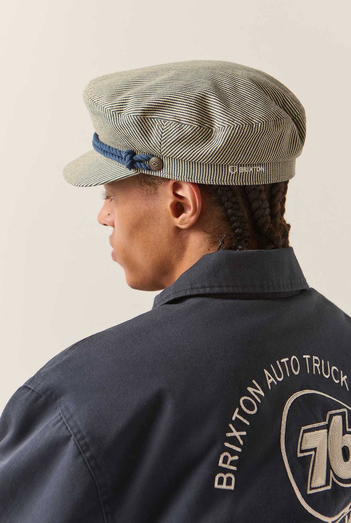 Unisex 76 Fiddler Fisherman Cap in the color Navy/Off White Hickory Stripe - Men's Back View