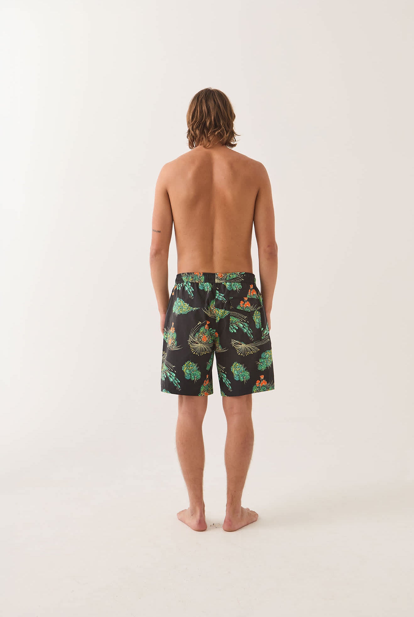 Men's Everyday Stretch Hybrid Short 7" in the color Black Floral - Men's Back View