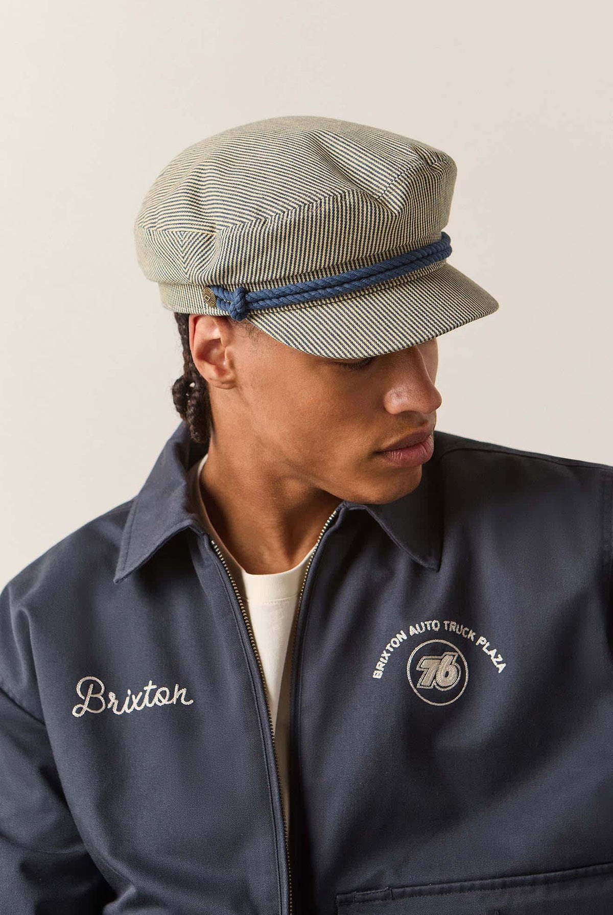 Unisex 76 Fiddler Fisherman Cap in the color Navy/Off White Hickory Stripe - Men's Side View