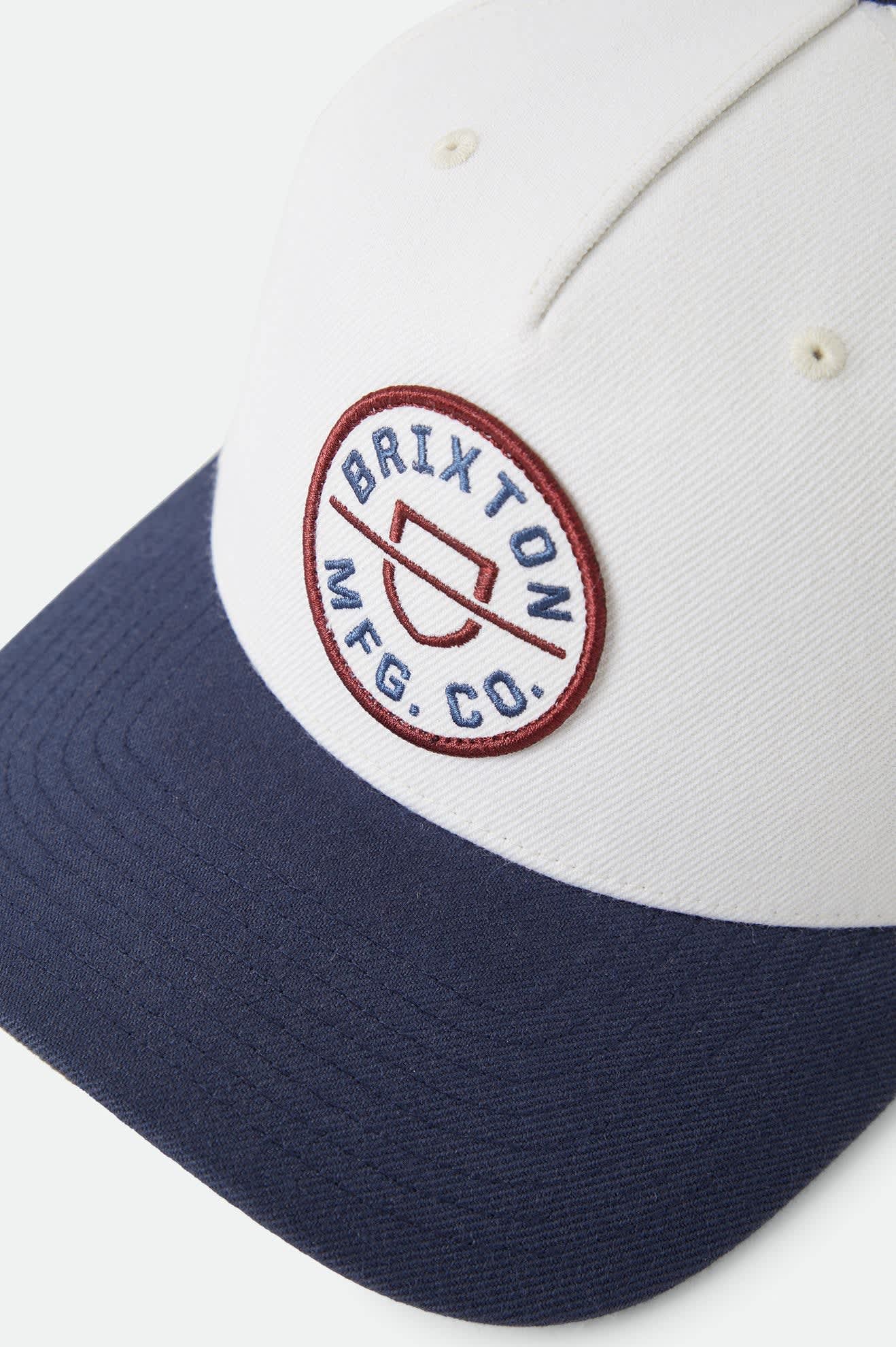 Unisex Crest Snapback in the color Wax Paper/Navy - Additional Laydown image