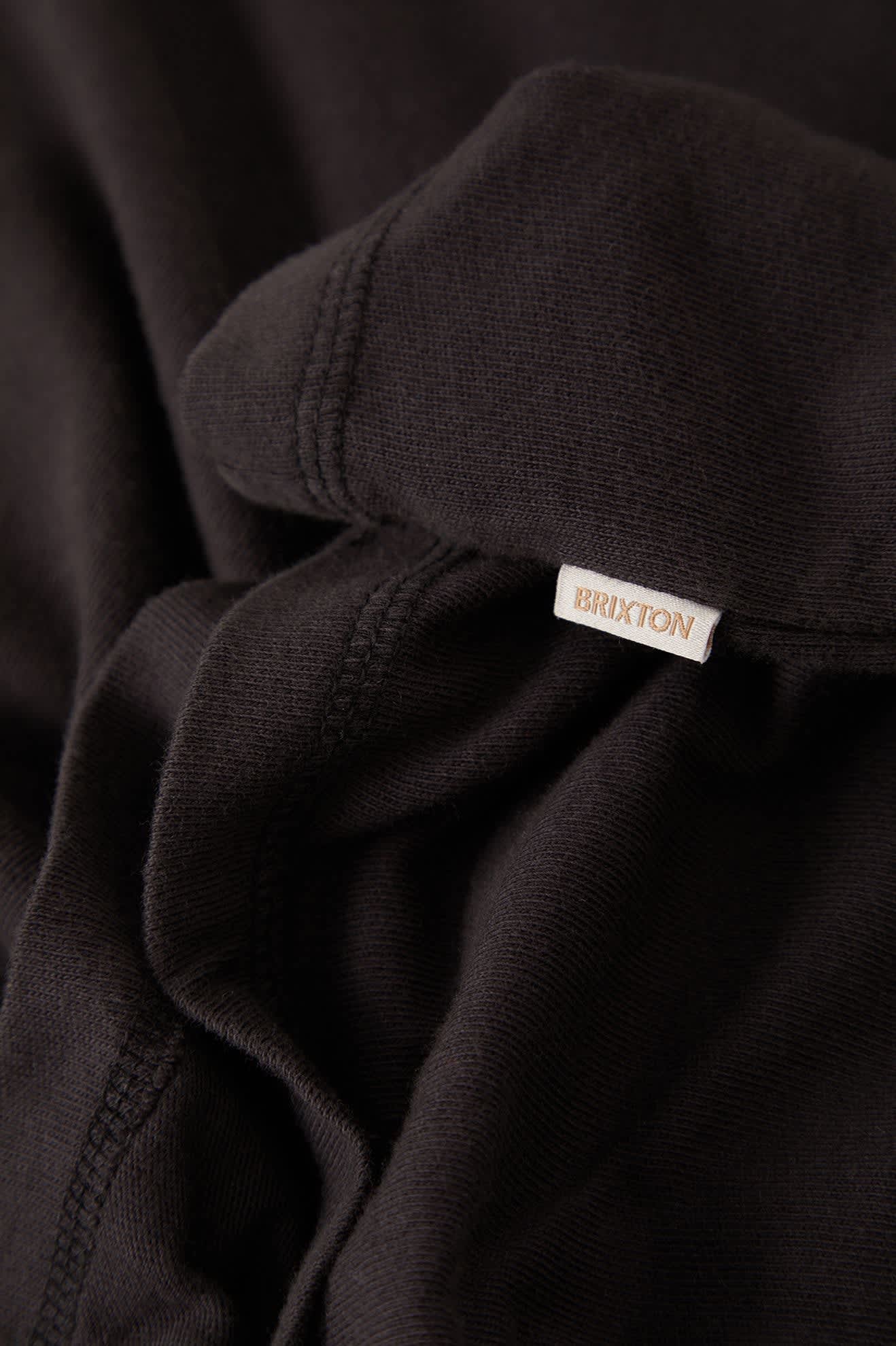 Women's Carefree Organic Garment Dye Cropped Henley in the color Black - Additional Laydown image