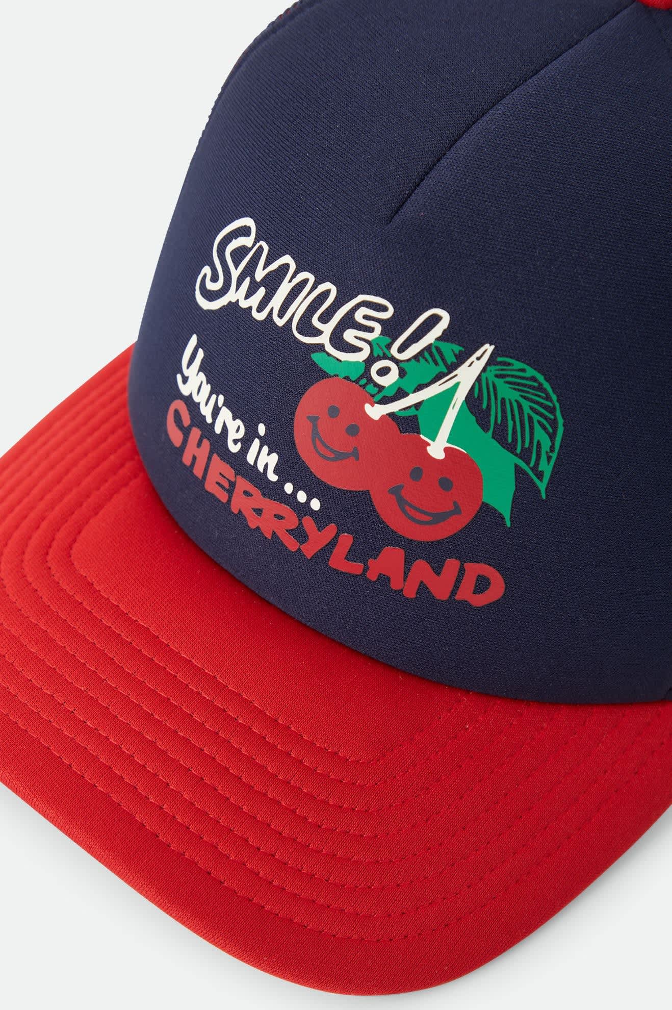 Unisex Cherryland Trucker Hat in the color Washed Navy/Crimson - Additional Laydown image