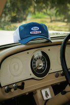 Unisex Phillips Netplus Trucker Hat in the color Denim/White - Additional Laydown image