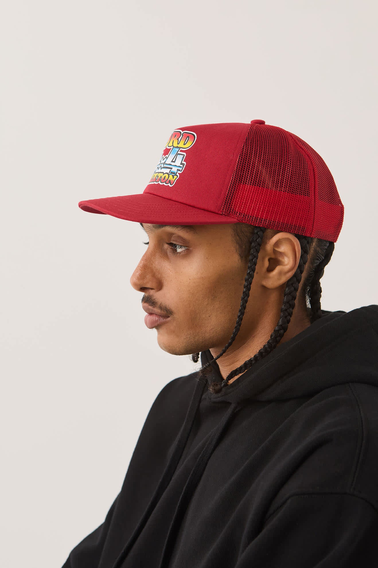 Unisex Ford 4x4 Chrome Trucker Hat in the color Rangoon Red - Men's Side View