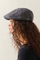 Unisex Brood Newsboy Cap in the color Indigo/Dark Sand - Women's Side View
