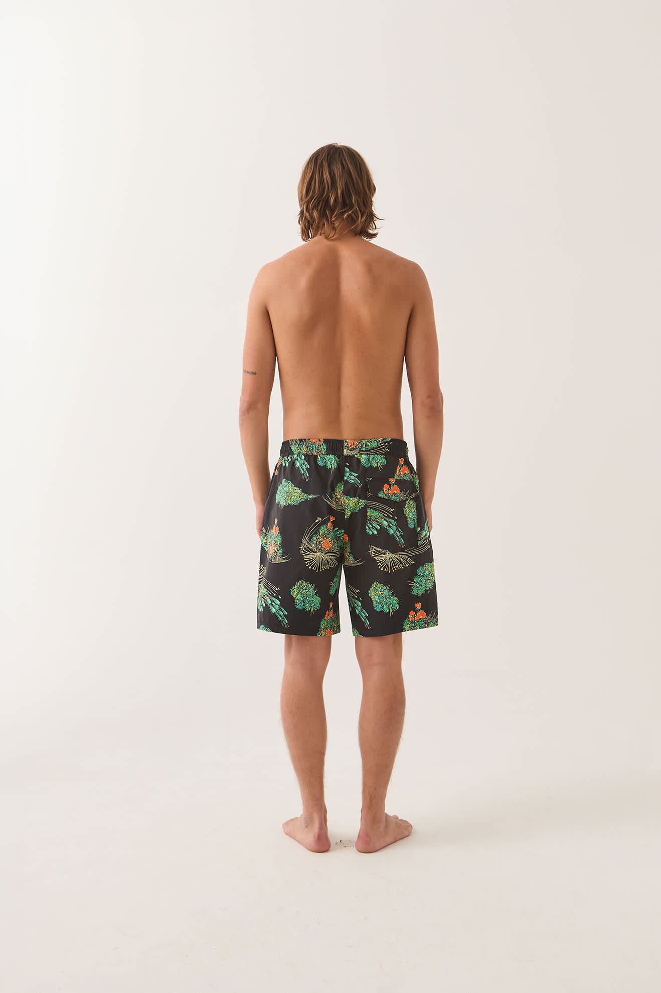 Men's Everyday Stretch Hybrid Short 7" in the color Black Floral - Men's Back View
