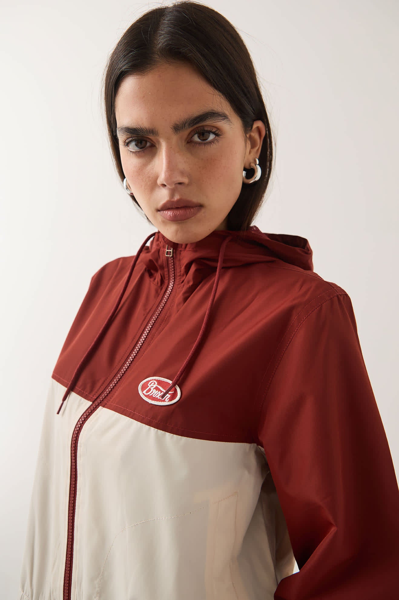 Women's Parsons Lightweight Hooded Windbreaker in the color Dark Brick/Whitecap - Additional Fit image