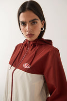 Women's Parsons Lightweight Hooded Windbreaker in the color Dark Brick/Whitecap - Additional Fit image