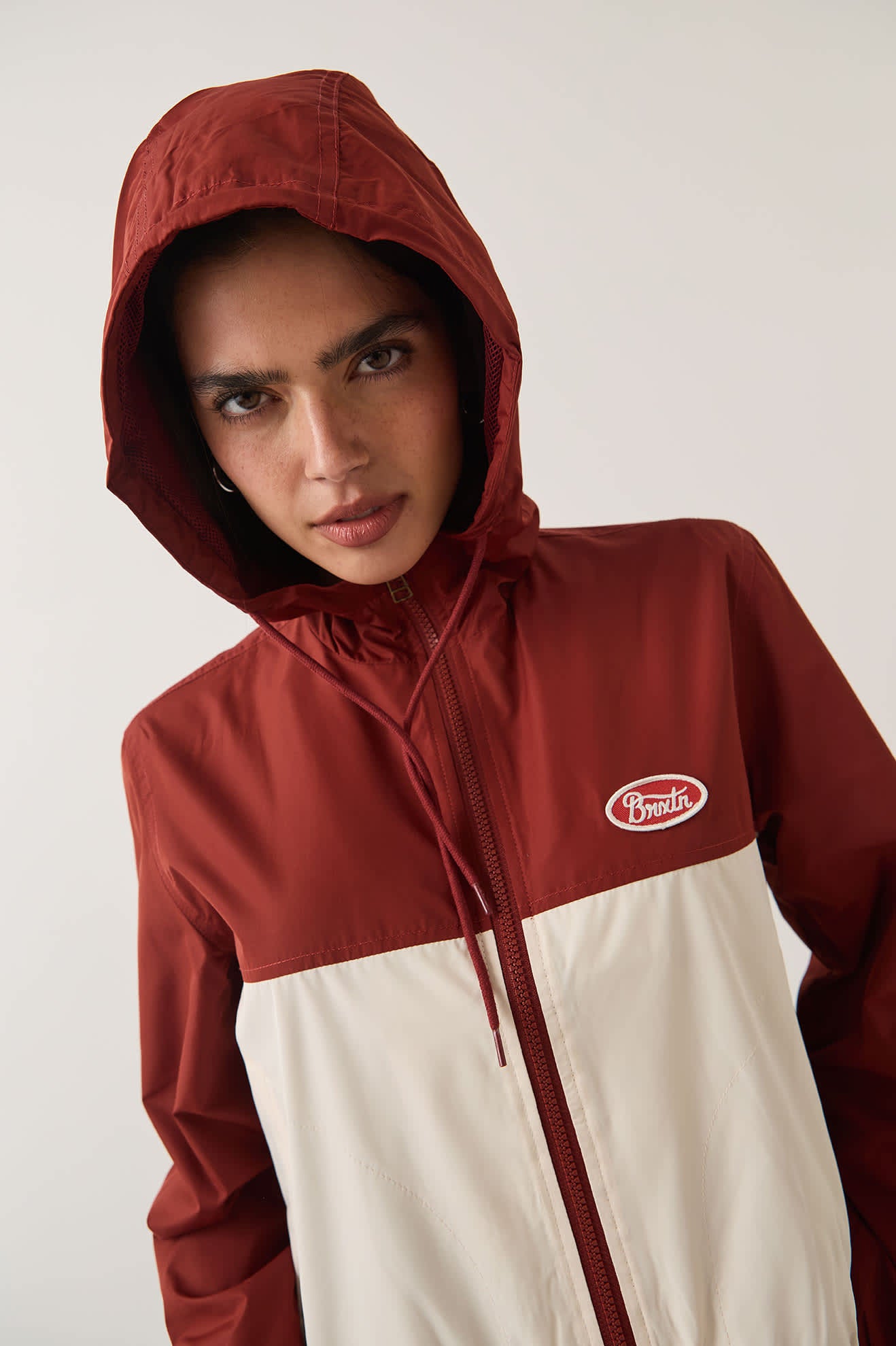Women's Parsons Lightweight Hooded Windbreaker in the color Dark Brick/Whitecap - Additional Fit image