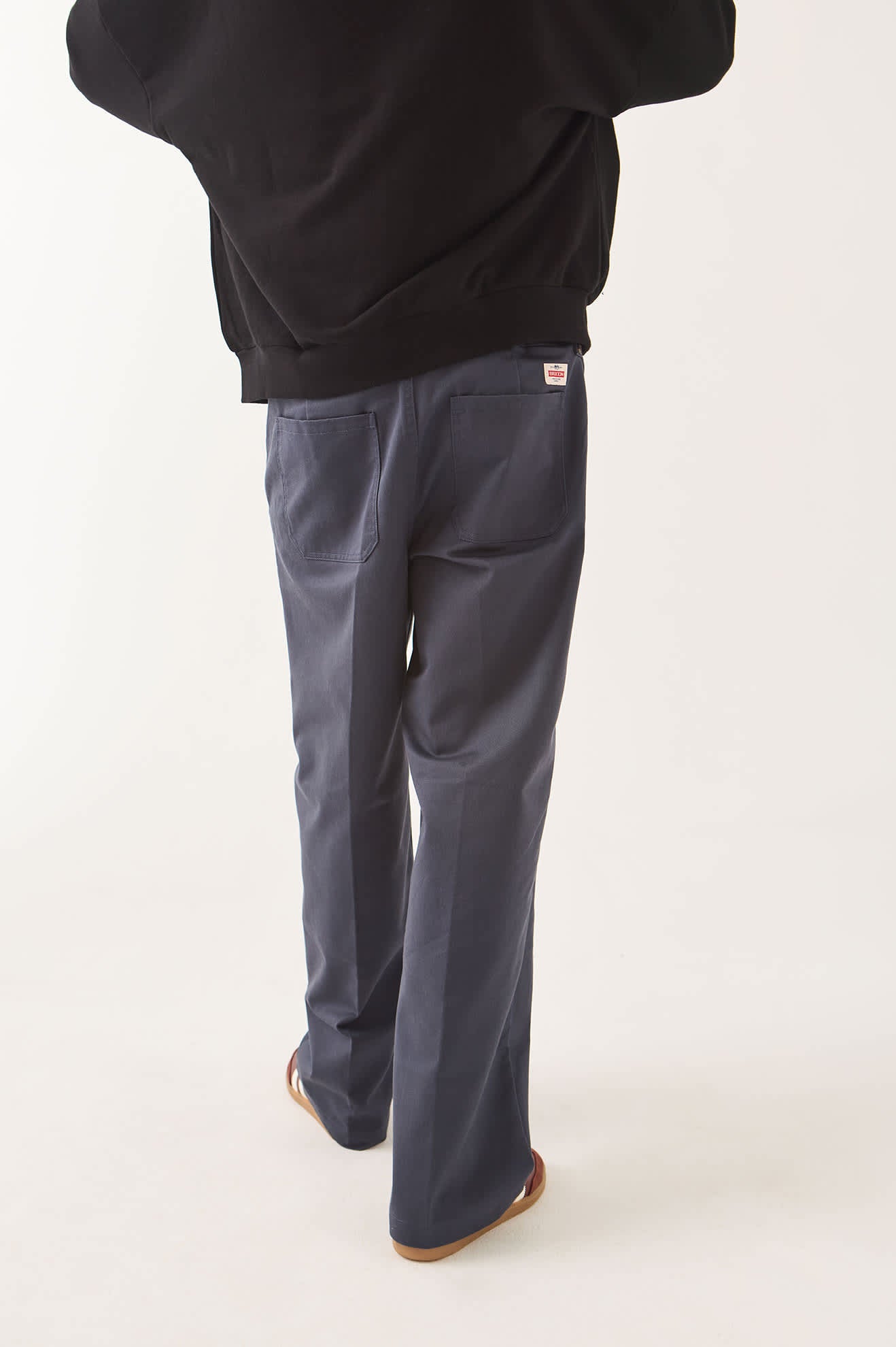 Men's Trademark Chino Pant in the color Washed Navy - Men's Back View